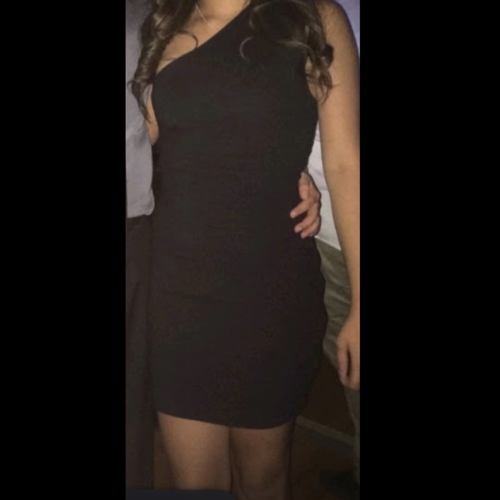 A fitting dress black , half shoulder dress
